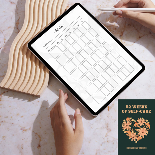 Person using a tablet with a self-care planner on a marble surface, next to a book titled '52 Weeks of Self-Care'.