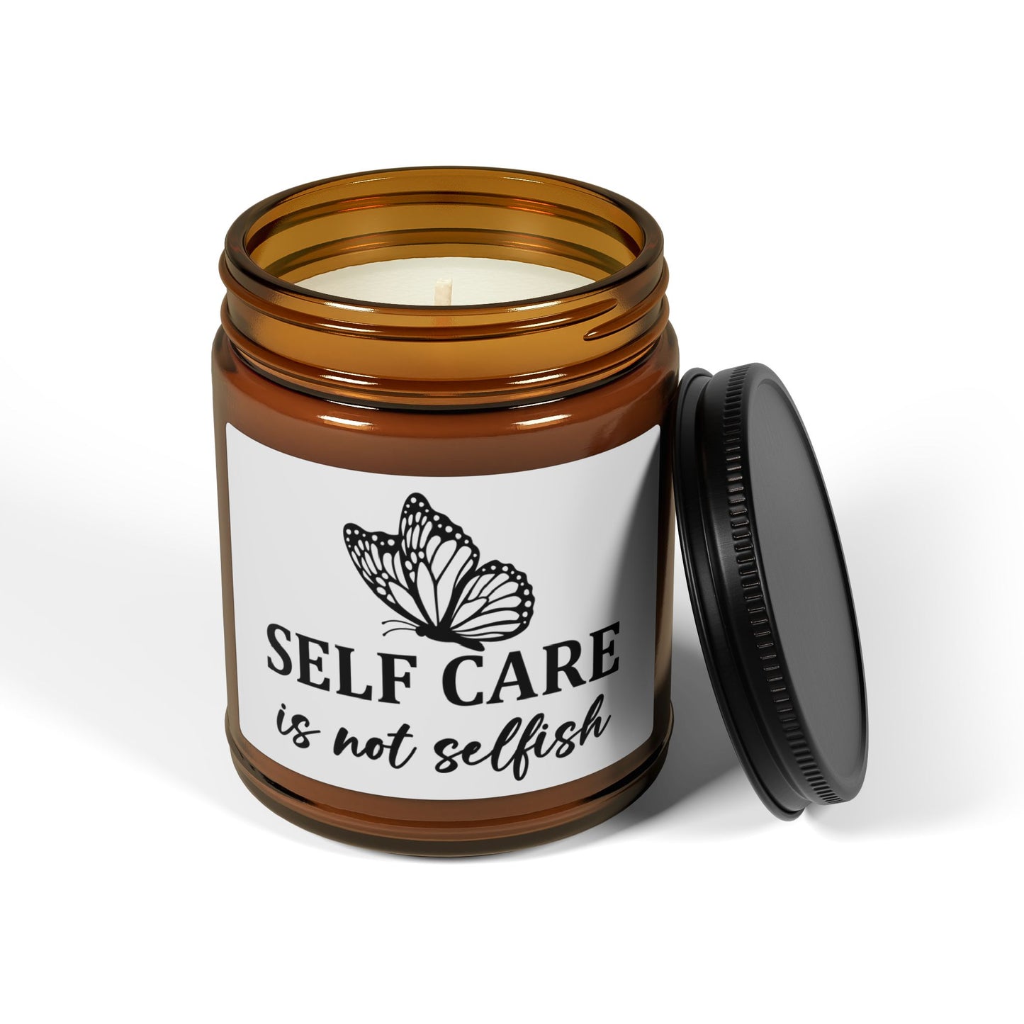 Candle in an amber jar with a butterfly label on a white background