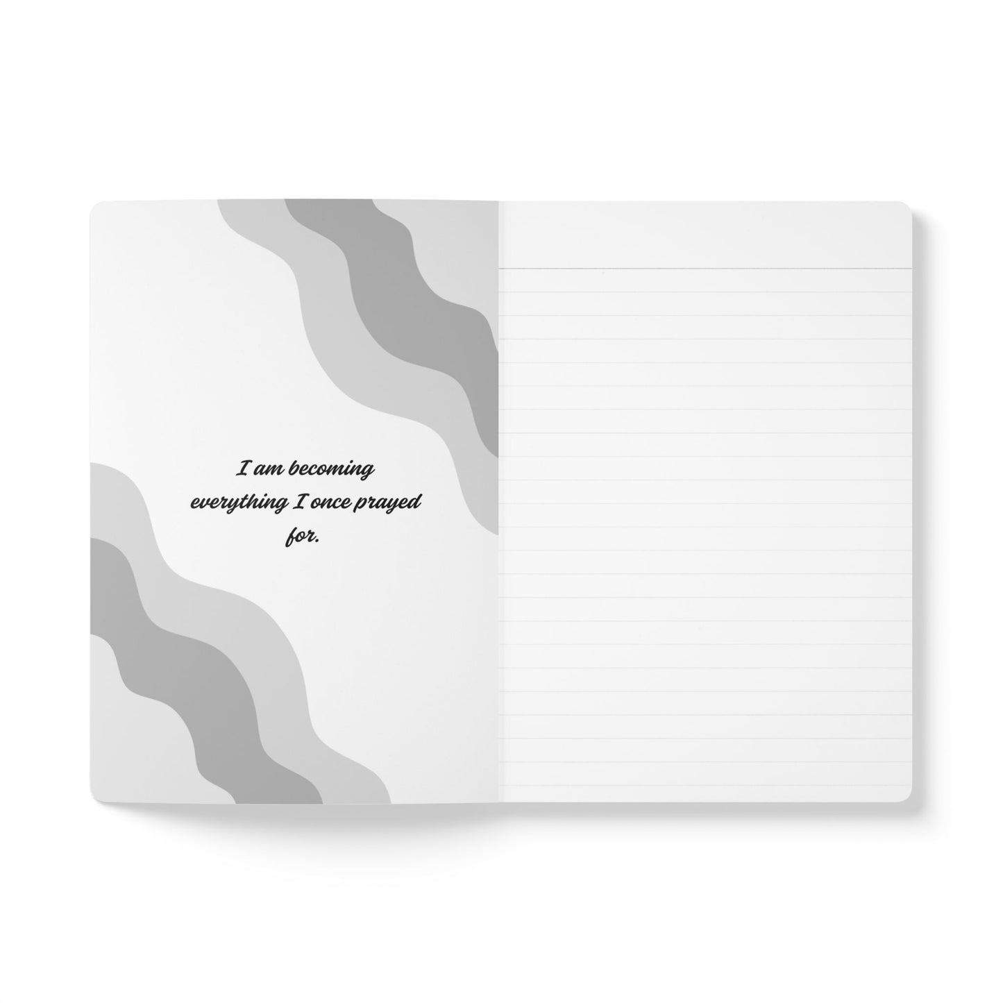 Notebook with gray wavy design and motivational quote on a white background
