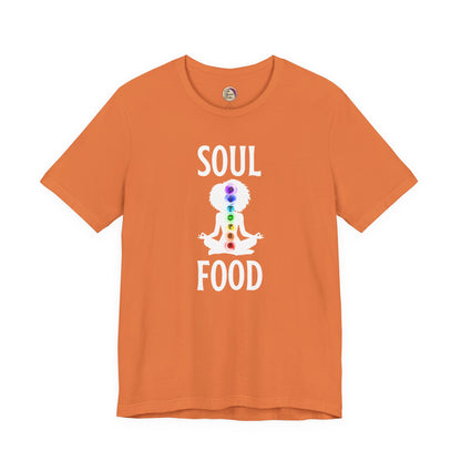 Orange t-shirt with 'Soul Food' design featuring a person in a meditative pose with chakra colors on a white background.